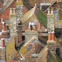 Buy canvas prints of Rooftops by susan potter