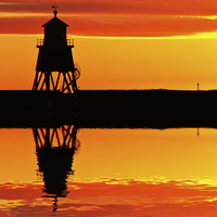 Buy canvas prints of Groyne Lighthouse at Sunrise by David Pringle