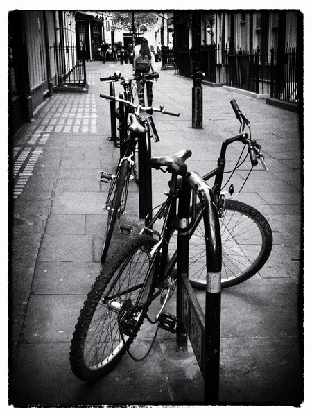 Bicycles in a London Street Picture Board by Lynn Bolt