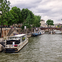 Buy canvas prints of The River Seine Paris by Lynn Bolt