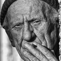 Buy canvas prints of Man having a cigarette by Rory Trappe