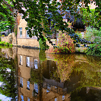 Buy canvas prints of Reflections on the canal. by Irene Burdell