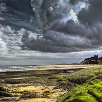 Buy canvas prints of Dramatic skys over Bamburgh Castle and beach by Kevin Tate