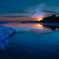 Buy canvas prints of Bamburgh Blue Sunrise by Kevin Tate