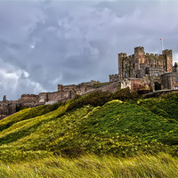 Buy canvas prints of Bamburgh Castle Stormy Skies by Northeast Images
