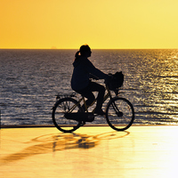 Buy canvas prints of Blackpool Biker At Sunset by Jason Connolly