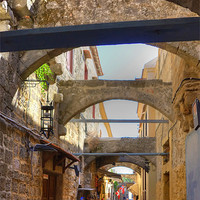 Buy canvas prints of An alley in Rhodes Town by Tom Gomez
