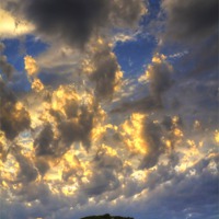 Buy canvas prints of Clouds over Pueblo Espárragos by Tom Gomez