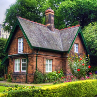 Buy canvas prints of Cottage in Princes Street Gardens by Tom Gomez