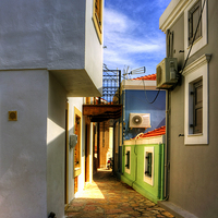 Buy canvas prints of Chalki Alleyway by Tom Gomez