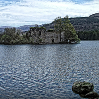 Buy canvas prints of Loch an Eilein Castle Ruin by Tom Gomez