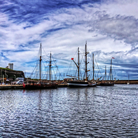 Buy canvas prints of Tall Ships in Whitehaven Harbour by Tom Gomez