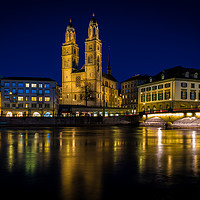 Buy canvas prints of Grossmunster Church At Blue Hour In Zurich by Chris Lord