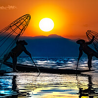Buy canvas prints of Burmese Fishermen In Silhouette Against The Sunrise by Chris Lord