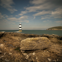 Buy canvas prints of Penmon Point Lighthouse and Puffin Island by Eddie John