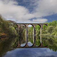 Buy canvas prints of The viaduct over Wayoh Reservoir by Eddie John