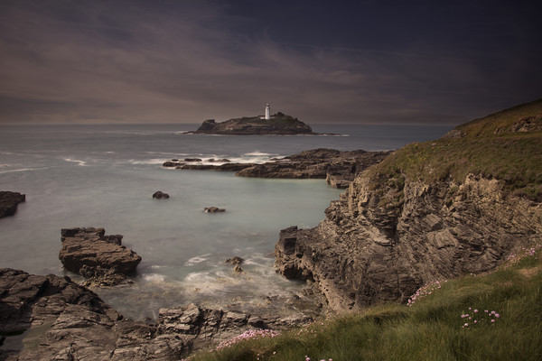 Godrevy lighthouse Cornwall at dusk Picture Board by Eddie John