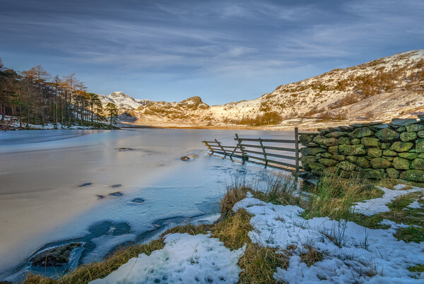 frozen lake in the lake district cumbria Picture Board by Eddie John