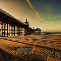 Buy canvas prints of Shadows Of The Pier by John Hare