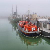 Buy canvas prints of Lowestoft Lifeboat in the Fog. by Lilian Marshall