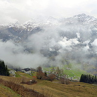 Buy canvas prints of Misty Swiss Alps.  by Lilian Marshall