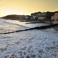 Buy canvas prints of Sunrise over Cromer Promenade. by Lilian Marshall