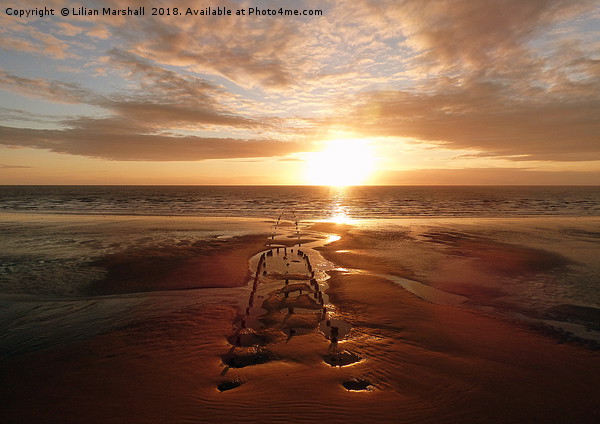 Sunset over Central Beach Blackpool Picture Board by Lilian Marshall