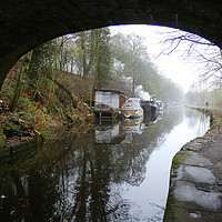 Buy canvas prints of Under the bridge on a misty day at Hebden Bridge. by Lilian Marshall