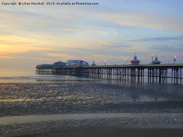 Sunset over North Pier. Blackpool in Lancashire.  Picture Board by Lilian Marshall