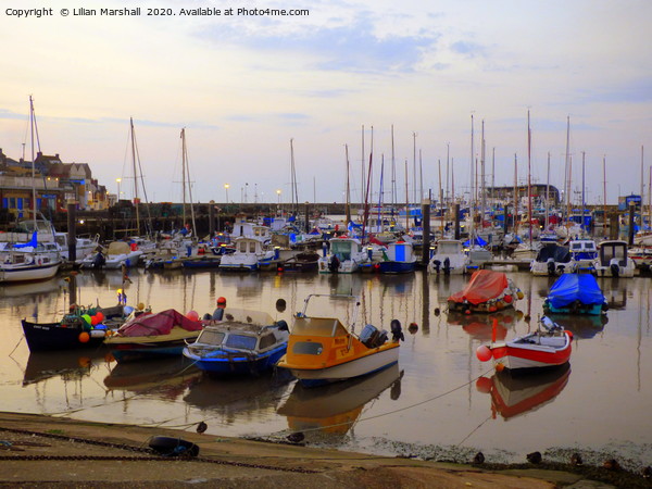 Sunrise over Bridlington Harbour.  Picture Board by Lilian Marshall
