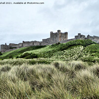 Buy canvas prints of Grey skies over Bamburgh Castle , Northumberland.  by Lilian Marshall