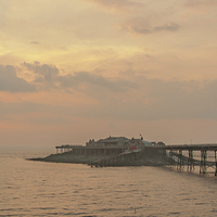 Buy canvas prints of Birnbeck pier sunset. by John Morgan