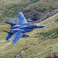 Buy canvas prints of Low Flying F 15 Fighter. by John Morgan