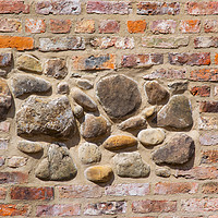 Buy canvas prints of Brick and stone wall texture by Robert Gipson