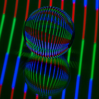 Buy canvas prints of Abstract art Red,Green, blue in the crystal ball. by Robert Gipson