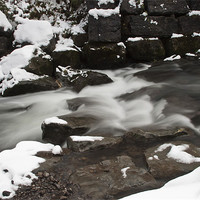 Buy canvas prints of Snowy Waterfall by Steve Purnell