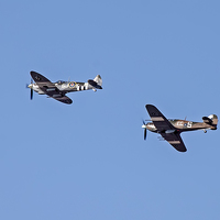 Buy canvas prints of Spitfires Above by Roger Green