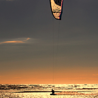Buy canvas prints of Kitesurfing at Sunset by Roger Green
