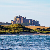 Buy canvas prints of Bamburgh Castle by Roger Green