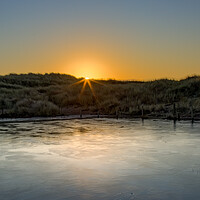 Buy canvas prints of Frozen Pond in the Ainsdale Sand Dunes by Roger Green