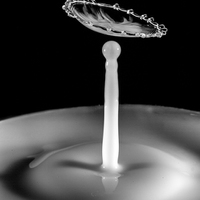 Buy canvas prints of Black and White Waterdrop Collision by Christine Johnson