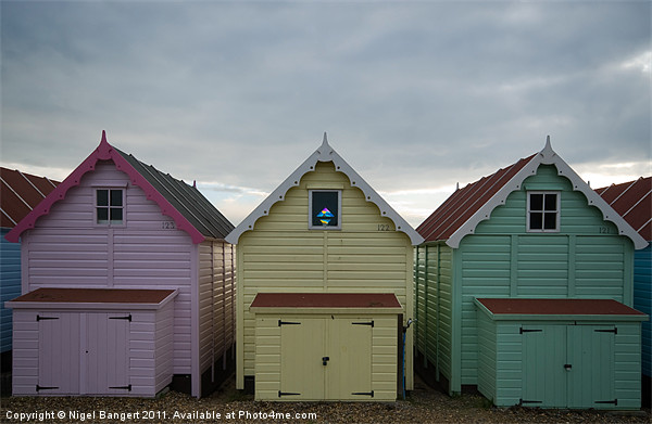 Beach Huts at Mersea Picture Board by Nigel Bangert