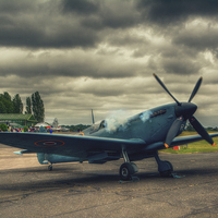Buy canvas prints of Reconnaissance Spitfire Fires Up by Nigel Bangert