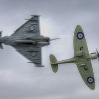 Buy canvas prints of  Eurofighter and Spitfire Pass by Nigel Bangert