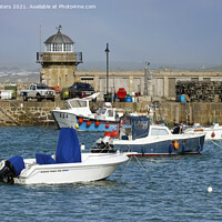 Buy canvas prints of The Old Lighthouse Smeaton's Pier St Ives by Terri Waters