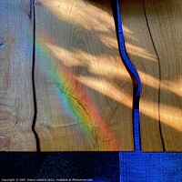 Buy canvas prints of Prism patterns alight on natural wood table by DEE- Diana Cosford