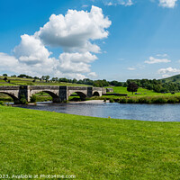 Buy canvas prints of Idyllic Burnsall Bridge Amidst Tranquil Dales by Colin Metcalf