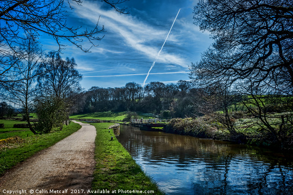 Vapour trails over the canal. Picture Board by Colin Metcalf