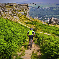 Buy canvas prints of Thrilling Descent: Mountain Biking at Ilkley Moor by Colin Metcalf