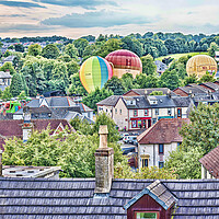 Buy canvas prints of Balloons Over Strathaven Roofs by Valerie Paterson
